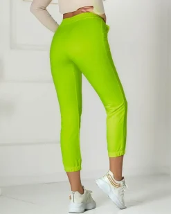 Best Neonowe żółte damskie spodnie dresowe z naszywką- Odzież Spodnie Dresowe