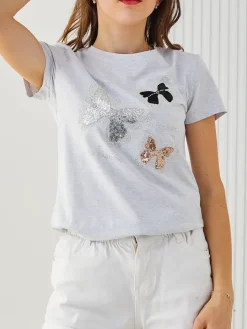 Outlet Bawełniana damska bluzka w motyle Bluzki / Koszule / Koszulki