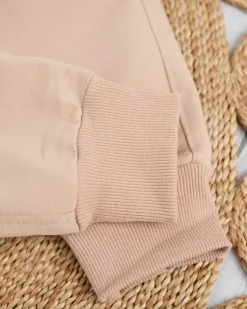 Sale Beżowe damskie spodnie dresowe z kolorową naszywką Spodnie Dresowe