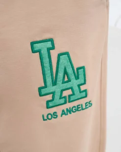 Sale Beżowe damskie spodnie dresowe z kolorową naszywką Spodnie Dresowe