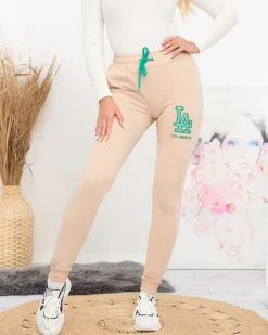 Sale Beżowe damskie spodnie dresowe z kolorową naszywką Spodnie Dresowe