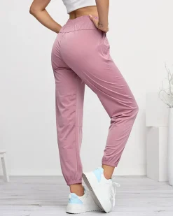 Best Ciemnoróżowe damskie spodnie dresowe typu joggery Spodnie Dresowe