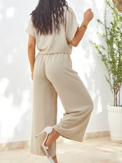 Clearance Damski komplet z wiązaną koszulą z krótkim rękawem i poszerzanymi spodniami z cyrkoniami Damskie Komplety Damskie