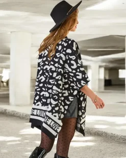 Sale Damskie ponczo z printem Swetry