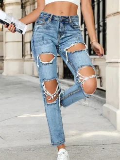 Clearance Jeansy damskie rurki z przetarciami Jeansy