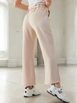 Szerokie spodnie materiałowe damskie z ozdobnym paskiem Spodnie Materiałowe