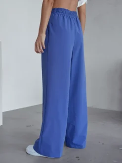 Szerokie spodnie damskie w kant Spodnie Materiałowe