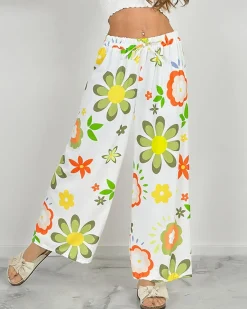 Szerokie spodnie damskie materiałowe w kwiaty Spodnie Materiałowe