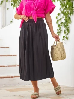 Wiskozowa Damska spódnica midi letnia i zwiewna z dwoma kieszeniami Spódnice