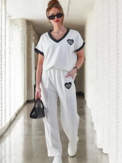 Sale Wiskozowy damski komplet z krótkim rękawem i poszerzanymi spodniami Damskie Komplety Damskie