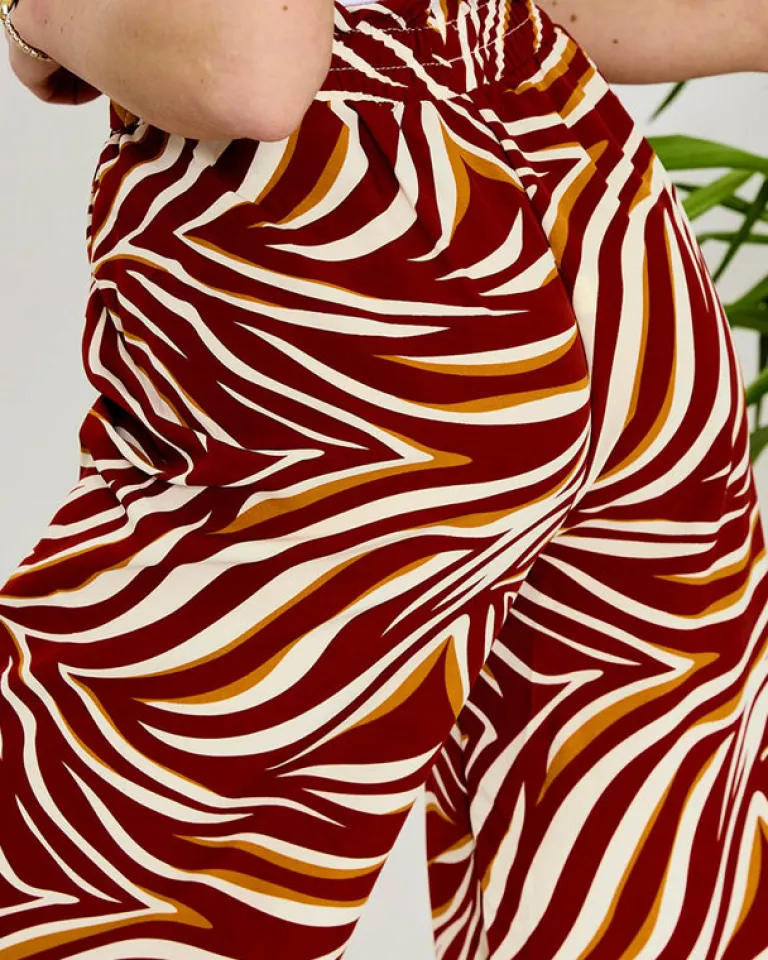 Outlet Wzorzyste spodnie damskie typu palazzo w kolorze m Spodnie Materiałowe